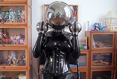 Girl In Latex And Metal And Chastity Belt With Vibrator